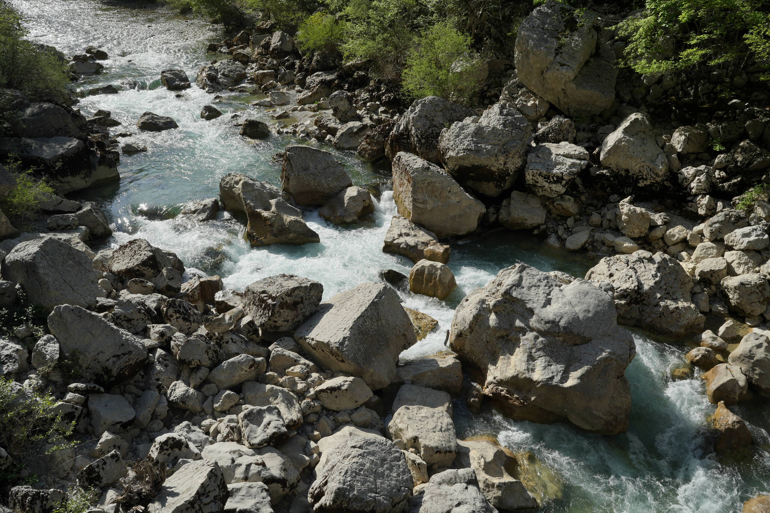An image of rocks near bridge.